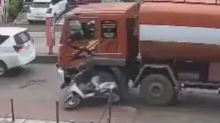 Moped Rider Slips, Falls And Gets Run Over By Tunker Truck