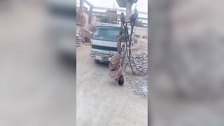 Pakistan: Marble factory owner hanging a worker upside down from crane