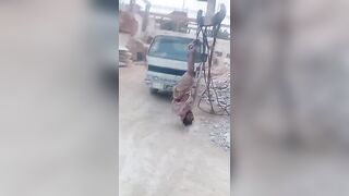 Pakistan: Marble factory owner hanging a worker upside down from crane