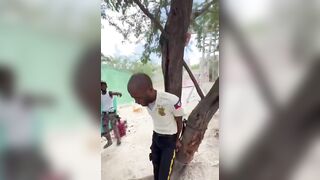 Police Officer Beaten And Humiliated By Thugs In Haiti