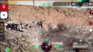 Dozens of dead Russians are lying scattered along the path.