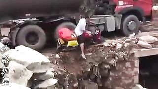 Old man falls into a pit trying to avoid truck