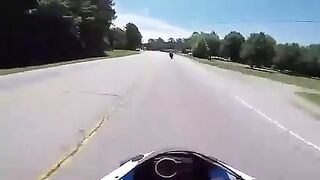 Biker slides under a turning truck