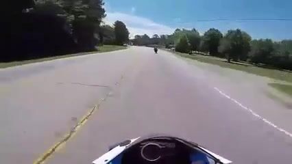 Biker slides under a turning truck