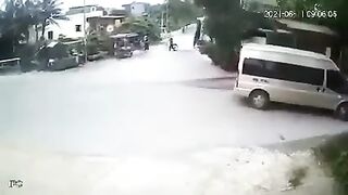 Small Truck Sweeps Up A Cyclist