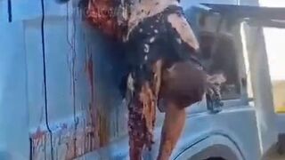 Dead corpse of pedoruzzian truck driver swaying from a cabin on occupied territories
