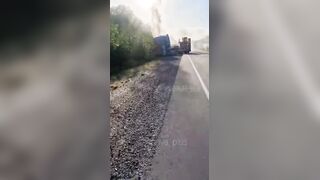 Dead corpse of pedoruzzian truck driver swaying from a cabin on occupied territories