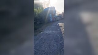 Dead corpse of pedoruzzian truck driver swaying from a cabin on occupied territories