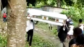 Classic: Body falls off coffin During traditional dance