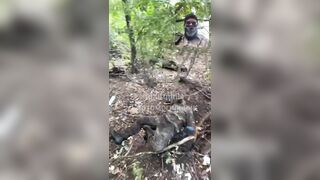 Colombian merc films his dead friend.