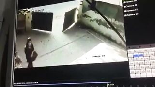 cctv captures a woman commit suicide by gunshot to the head (pakistan)
