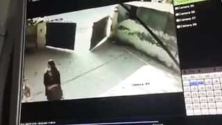 cctv captures a woman commit suicide by gunshot to the head (pakistan)