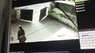 cctv captures a woman commit suicide by gunshot to the head (pakistan)