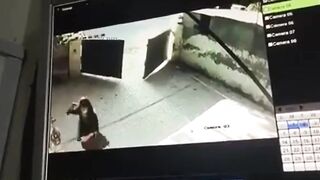 cctv captures a woman commit suicide by gunshot to the head (pakistan)