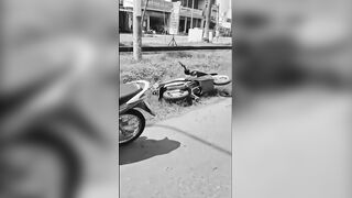 Woman Riding A Moped Falls Head First Under Truck Wheels