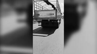 Woman Riding A Moped Falls Head First Under Truck Wheels