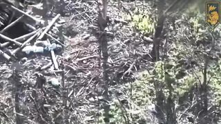 Ukrainian soldier shoots two ruzzian invaders from dugout.
