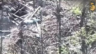 Ukrainian soldier shoots two ruzzian invaders from dugout.