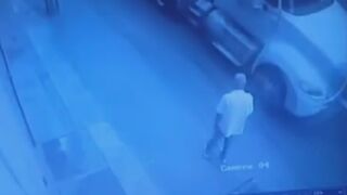 Man waits patiently for a truck to come by before purposely throwing himself under it