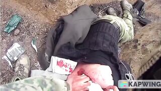 RUSSIAN MEDIC AND WOUNDED COMRADE GETTING HIT BY ARTILLERY