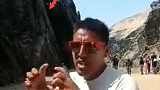 Classic: Man Falls From Cliff In The Background
