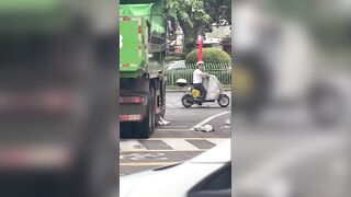 A woman is dead after getting hit by a dump truck while riding her e-bike