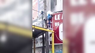 Worker Suffers Electric Shock During Advertising Installation