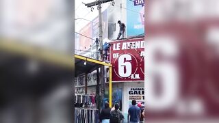 Worker Suffers Electric Shock During Advertising Installation