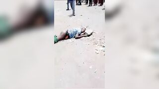 Thief Gets Killed With A Huge Rock On The Busy Road In Congo