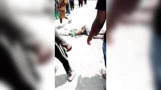 Thief Gets Killed With A Huge Rock On The Busy Road In Congo