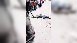 Thief Gets Killed With A Huge Rock On The Busy Road In Congo