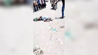 Thief Gets Killed With A Huge Rock On The Busy Road In Congo