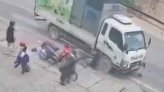 Couple On Mopd Run Over By Truck, One Dead