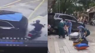 Rider Gets Crushed Against The Wall By Reversing SUV In China