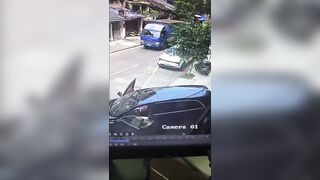Rider Gets Crushed Against The Wall By Reversing SUV In China