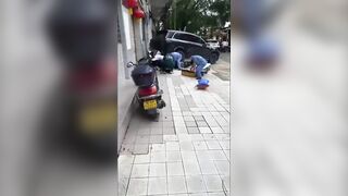 Rider Gets Crushed Against The Wall By Reversing SUV In China