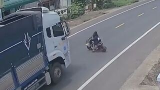 Reckless Rider Gets Run Over By Truck