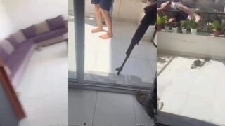 Unidentified Syrian militants forcing Druze men to jump off a balcony.