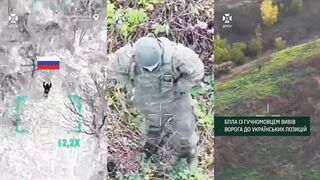 This ruzky invader begs for mercy, disarmed, surrendered to a drone and stay alive