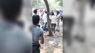 Man Brutally Attacked With a Sickle on Busy Street as Bystanders Watch in Shock