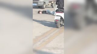 Young Woman Suffers A "Death Rattle" After Falling Off A Moped In China