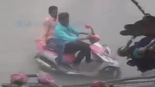 Two Men On Pink And White Moped Hit By Bus, One Dies