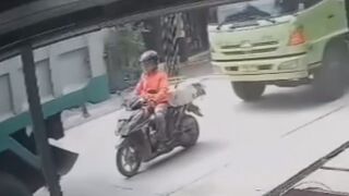 Motorcyclist Seriously Injured After Getting Sandwitched By Two Trucks