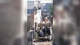 Man Throwing Sand During Celebration Falls From The Roof