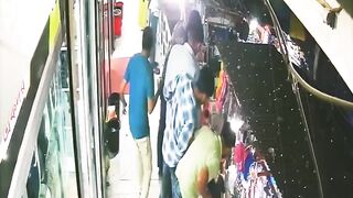 Two Men Plummet from 2nd Floor During Playful Moment in Crowded Bangladesh Market