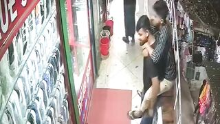 Two Men Plummet from 2nd Floor During Playful Moment in Crowded Bangladesh Market