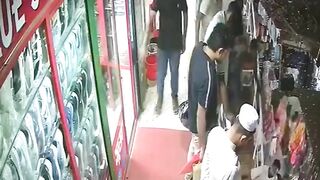 Two Men Plummet from 2nd Floor During Playful Moment in Crowded Bangladesh Market