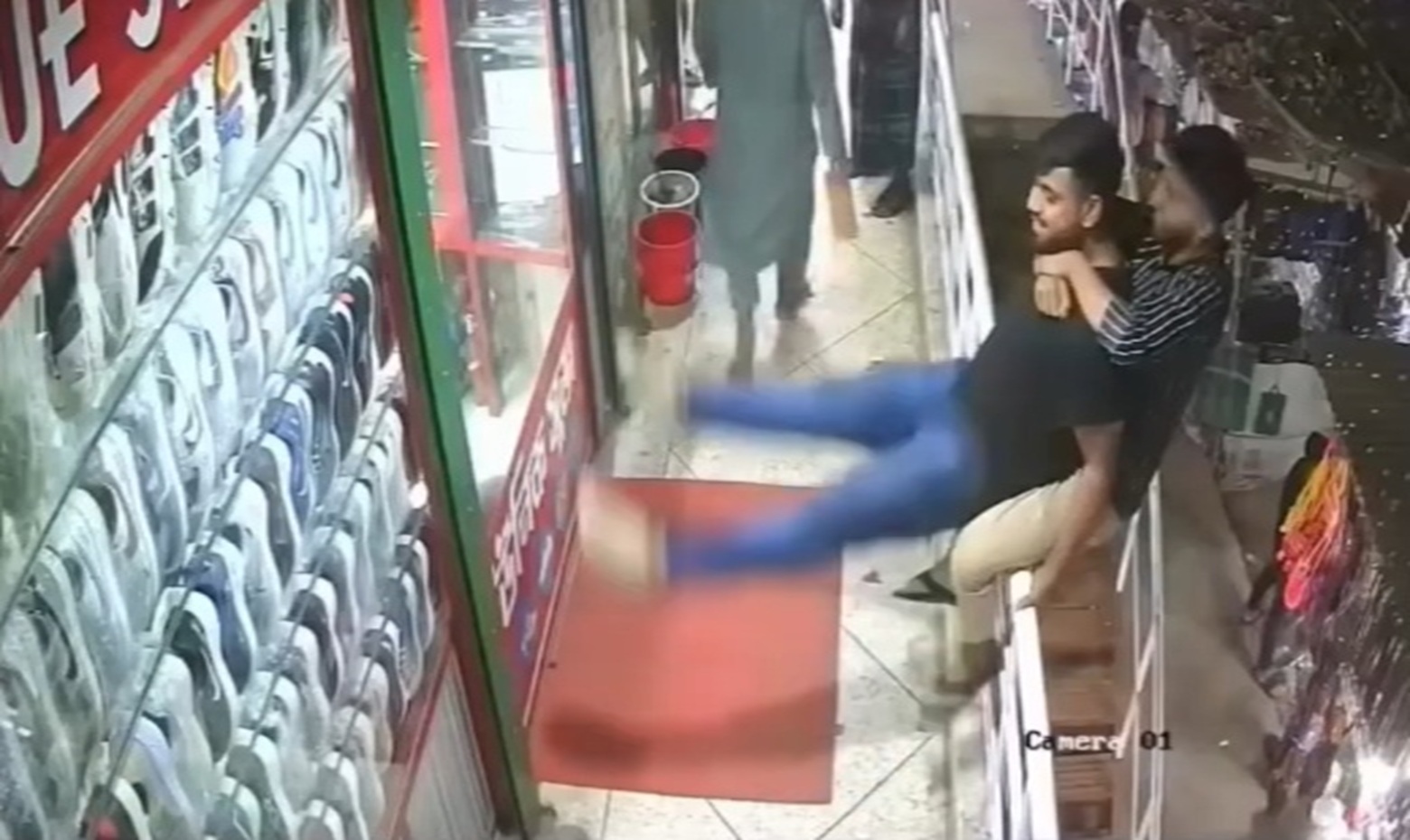 Two Men Plummet from 2nd Floor During Playful Moment in Crowded Bangladesh Market