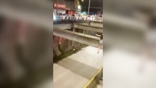 Desperate Young Woman Plunges from Bridge onto Busy Highway Before Shocked Crowd