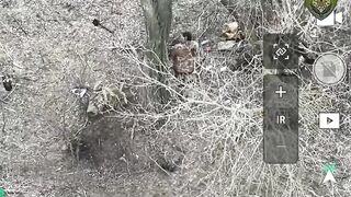 A russian soldier is hit by two drones simultaneously.